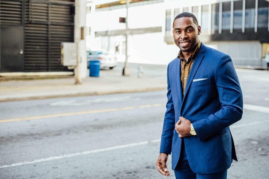 Man smiling while looking good in blue blazer