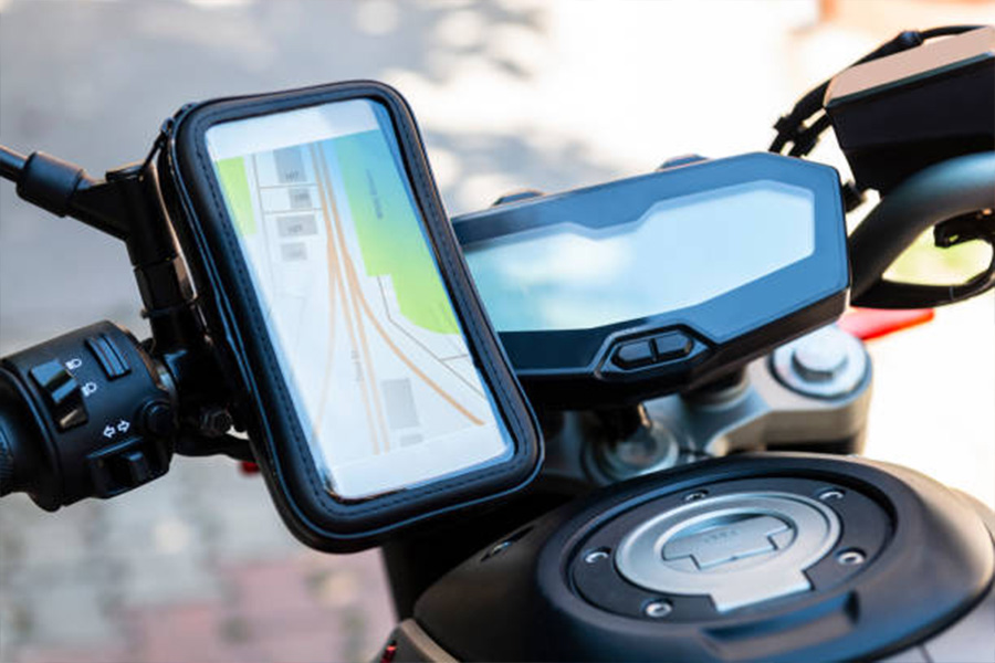 Phone mount on motorcycle handlebars with GPS being used