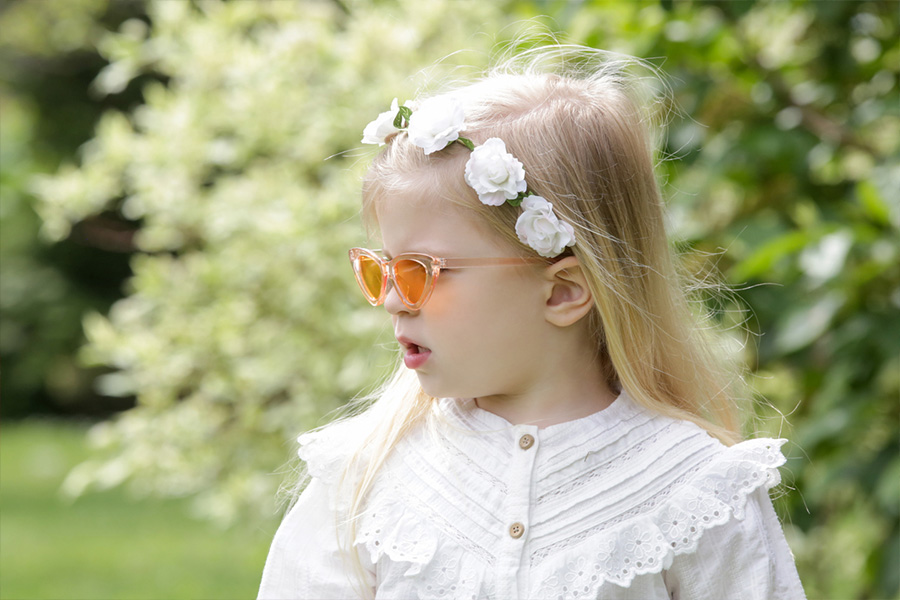 Toddler wearing a white Boho blouse