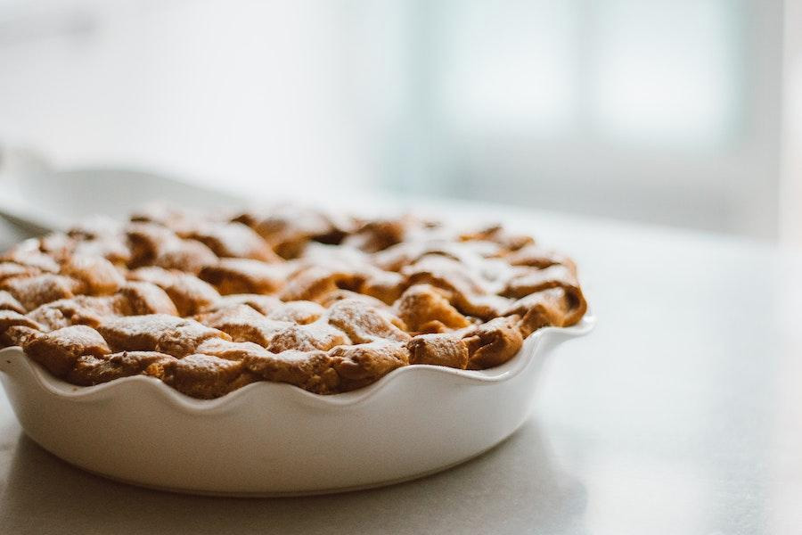 White pie plate on blurry background