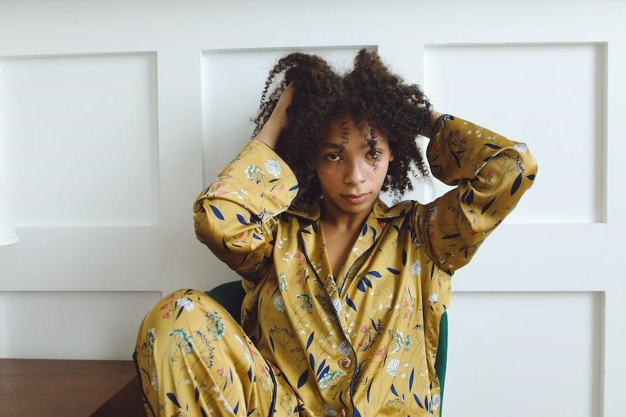 Woman posing in a yellow printed pajama