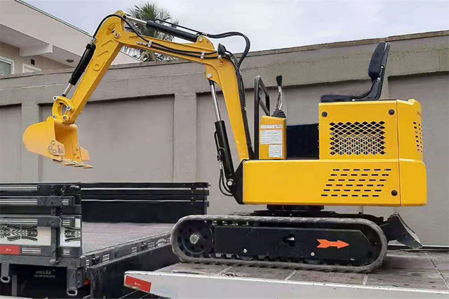 1.5 ton excavator loading onto a truck