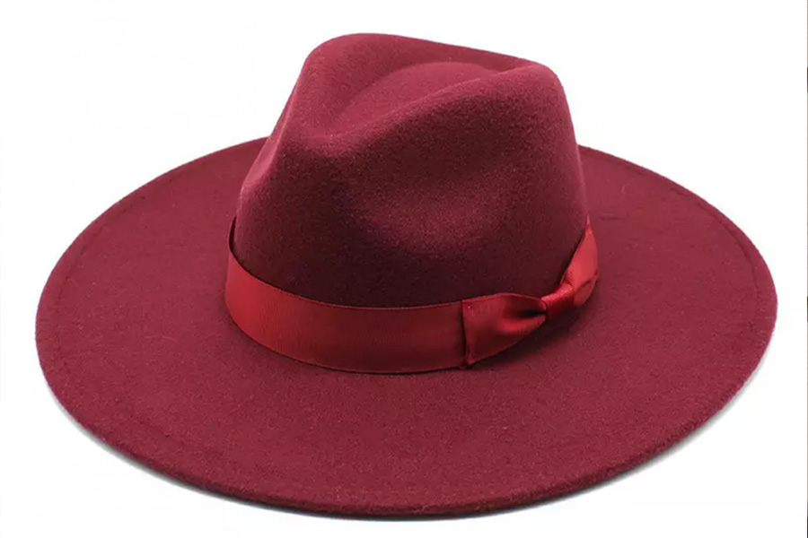 A dark red felt panama hat with silk red ribbon