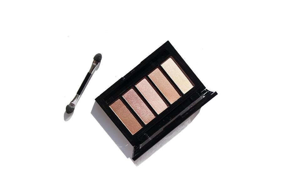 A small eyeshadow palette with multiple colorful pressed powders