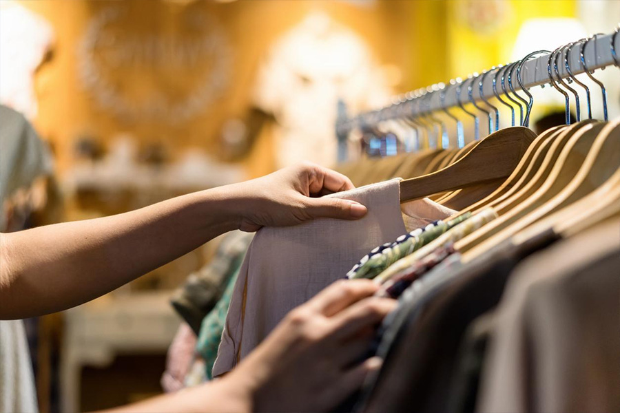 A woman looking at clothes in a store