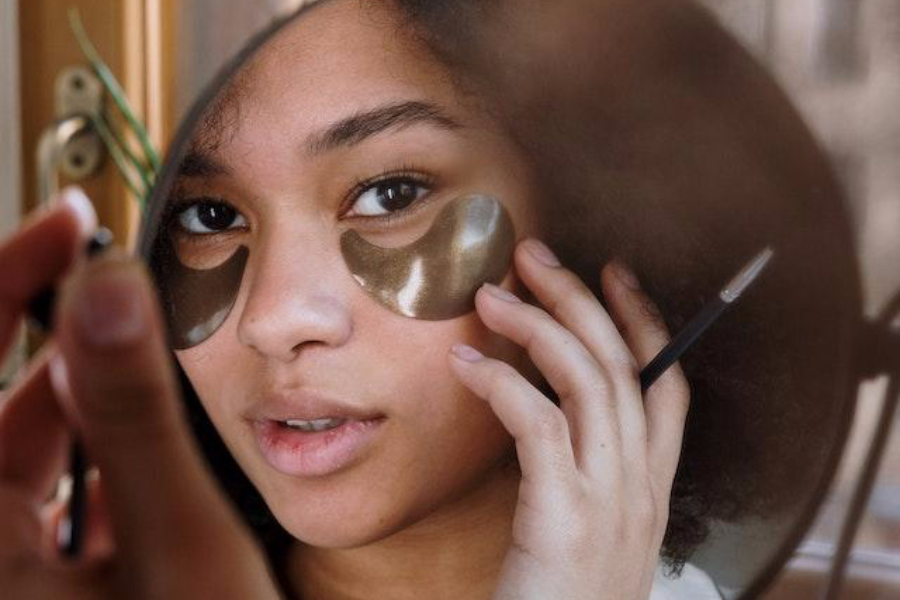 A woman wearing eye patches