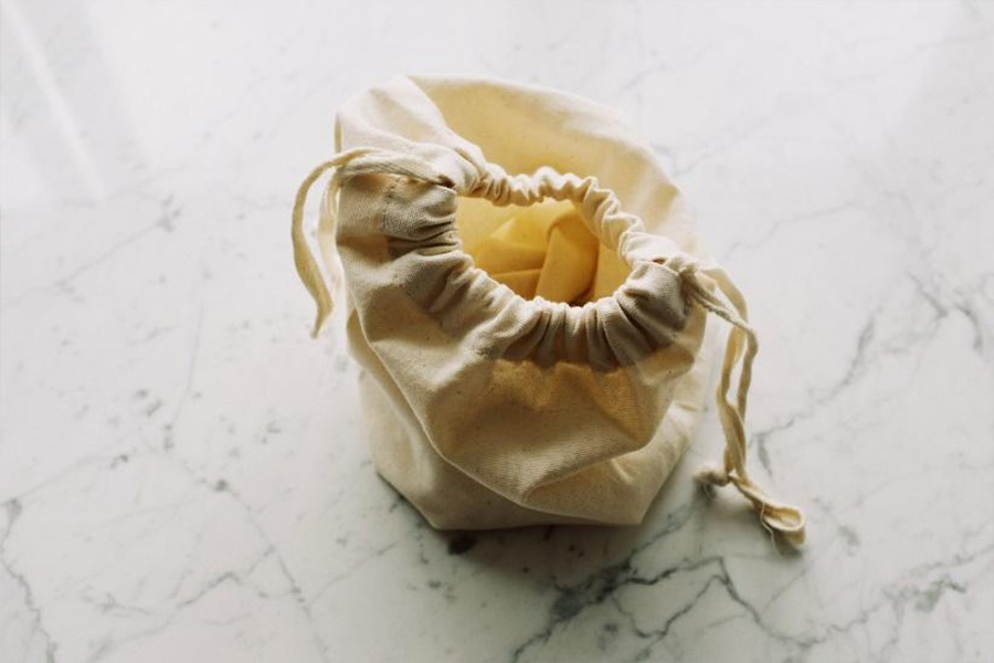 Beige cloth drawstring dust bag