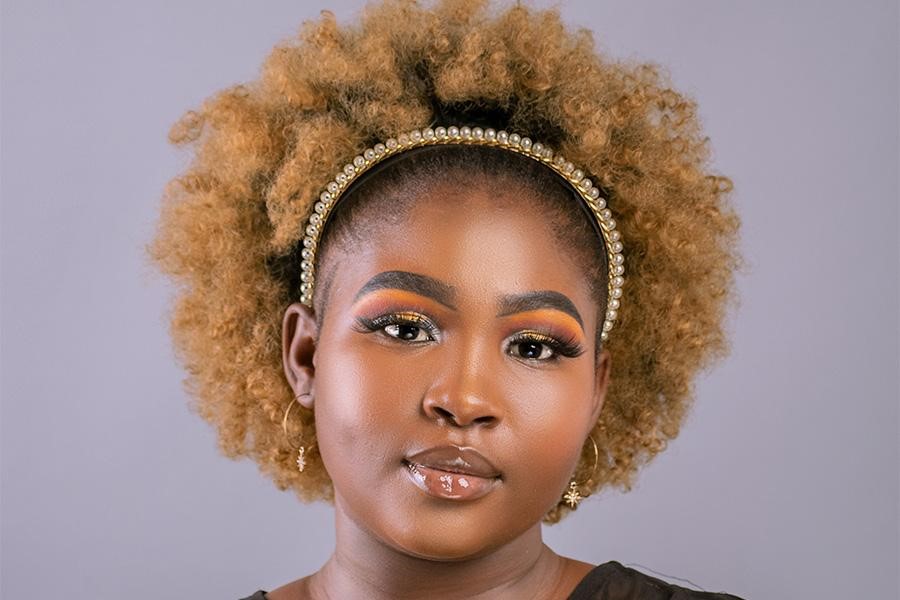 Black woman rocking an embellished pearl headband