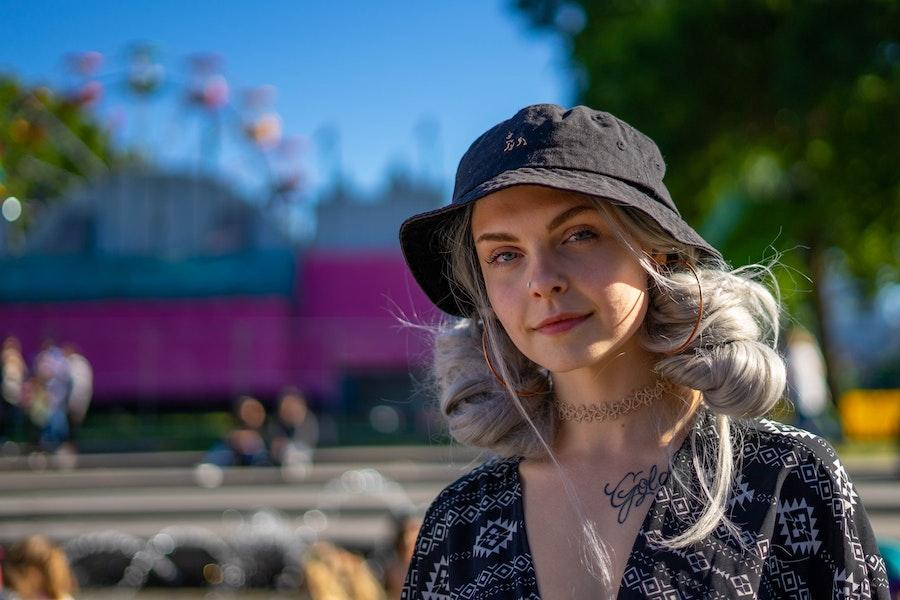 Blonde woman wearing a black bucket hat