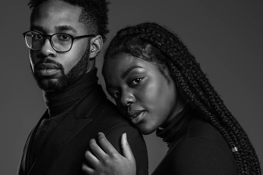 couple standing together looking at the camera