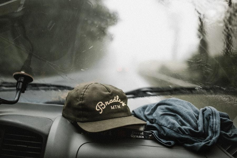 dad trucker hat resting on a dashboard