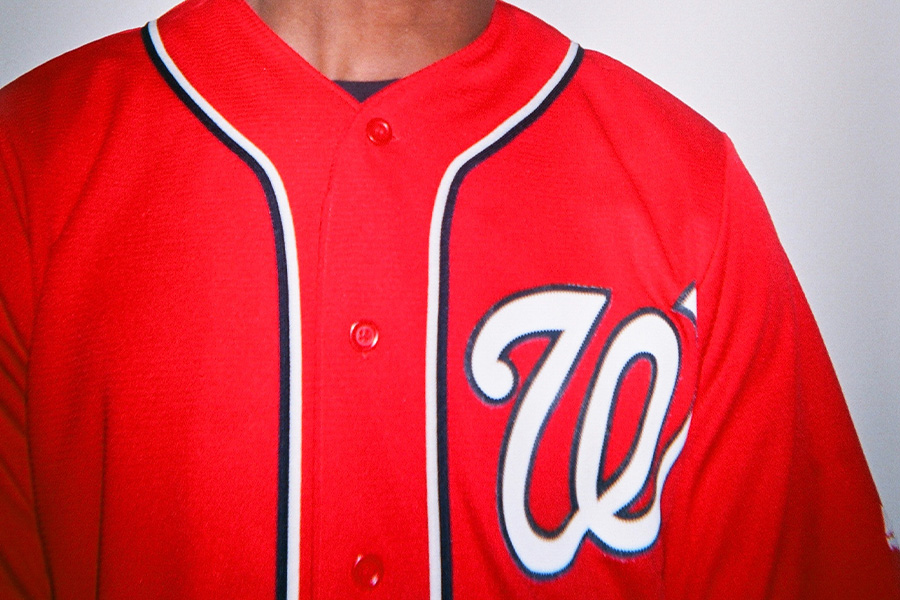 man donning a red baseball shirt