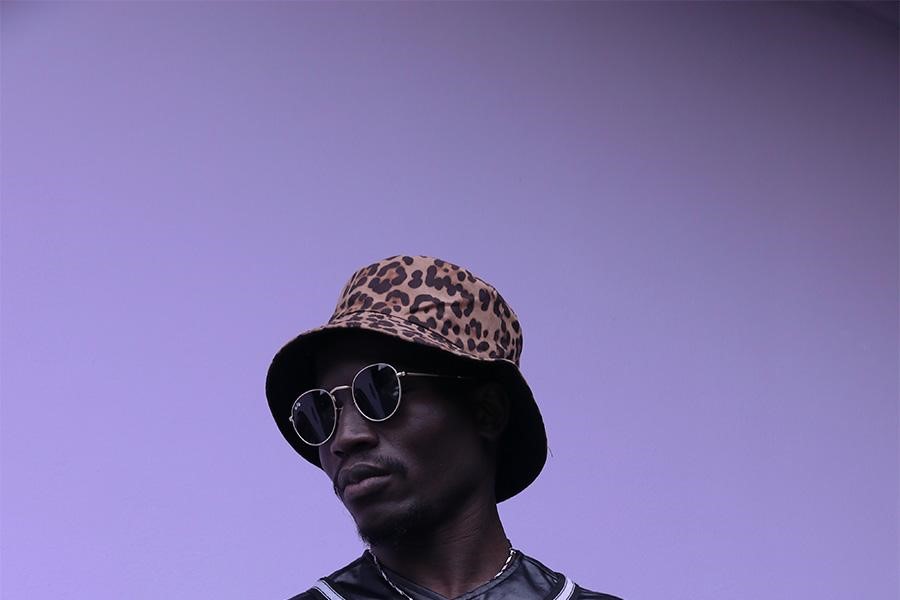 Man in a cheetah-print bucket hat