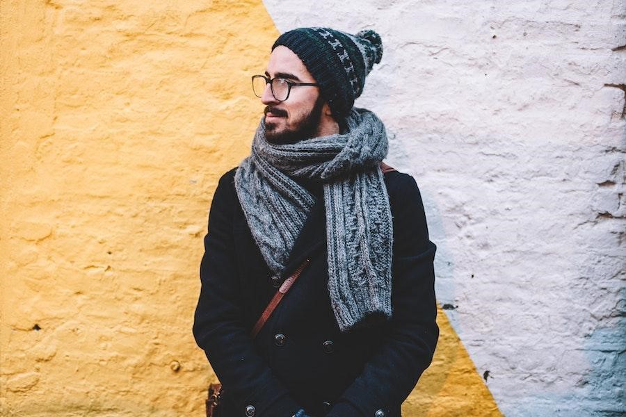 Man posing with a black bobble hat