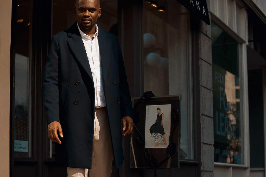 Man wearing a black trench coat