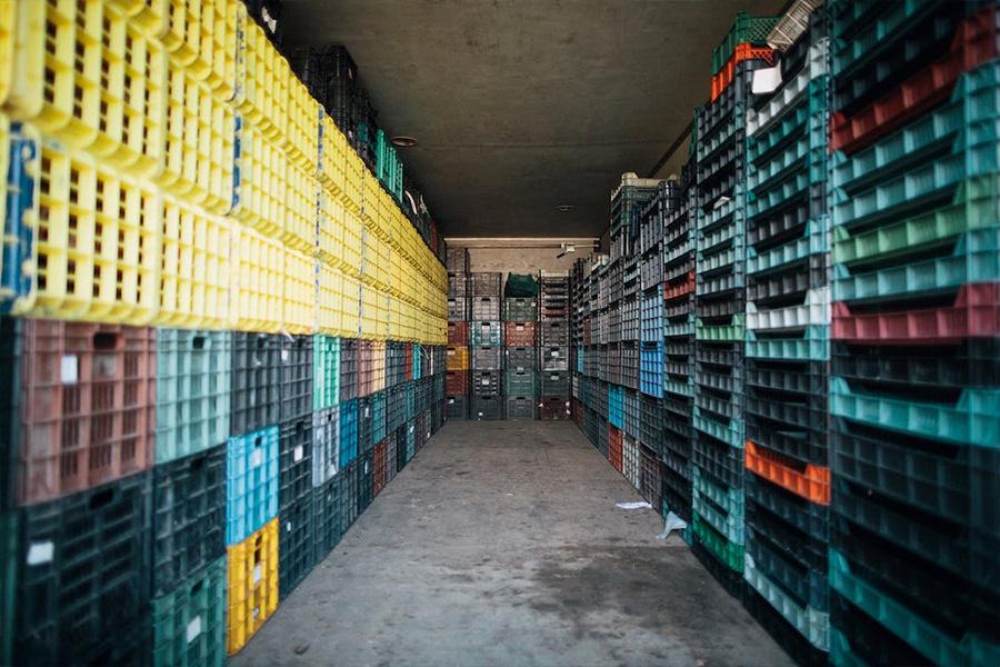 Piles of plastic containers in storehouse