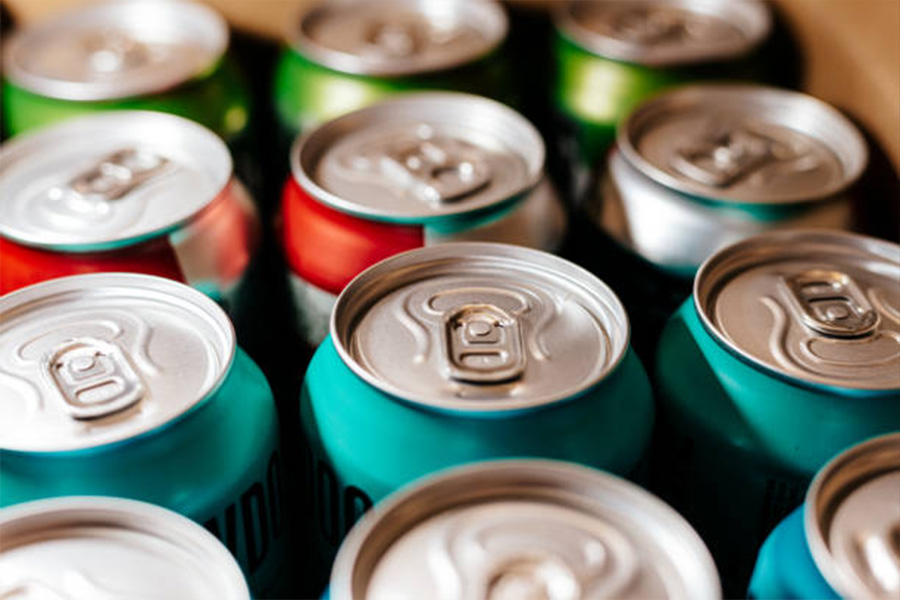 Rows of drink cans with different colors on packaging