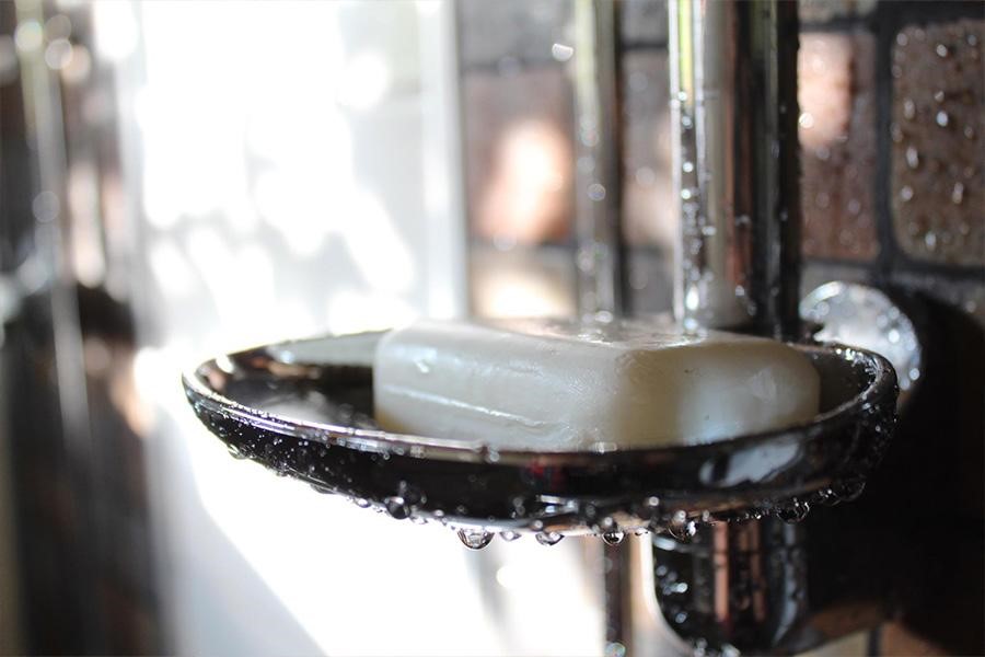 Solid bar of soap in a soap dish