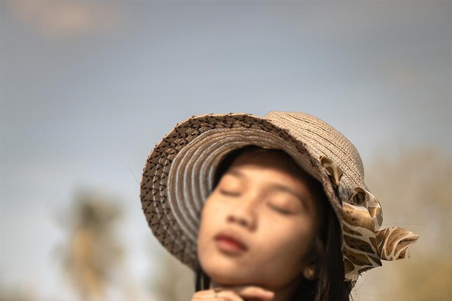 Woman posing in a crocheted bucket hat