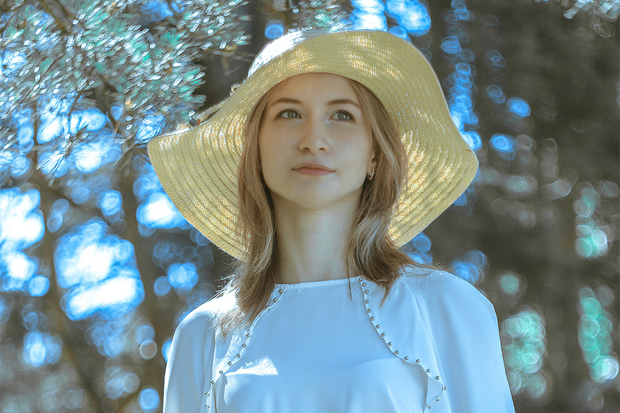 Woman posing in a floppy beach hat