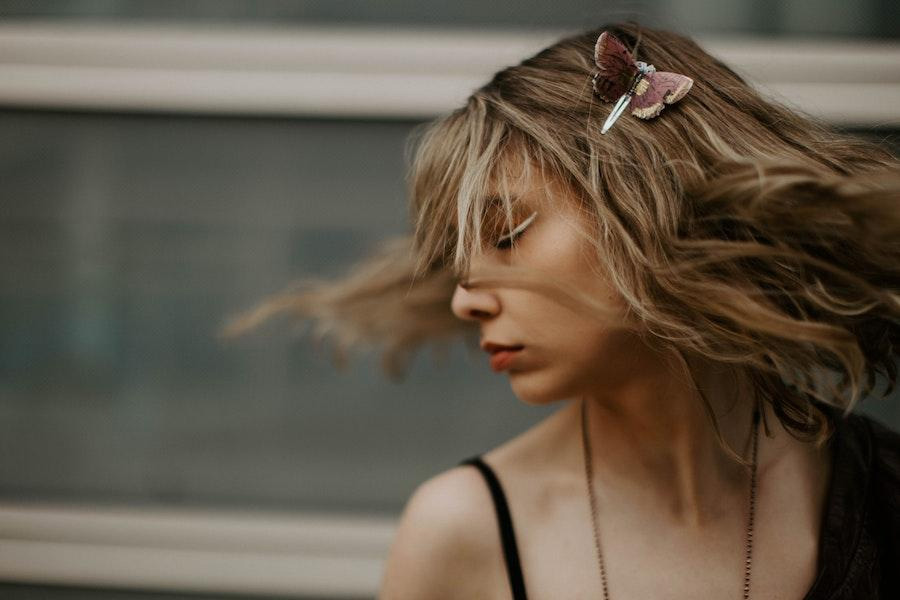 woman posing with a mini butterfly-shaped clip