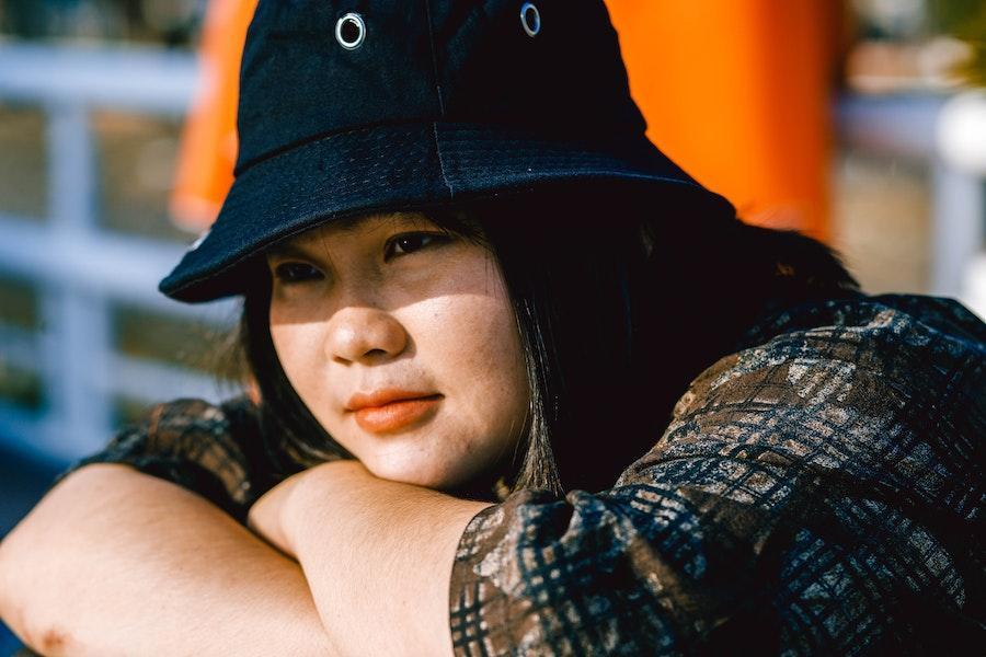 Woman rocking a denim bucket hat