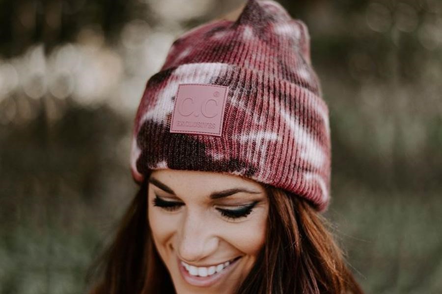 Woman rocking deep-colored tie-dye beanie