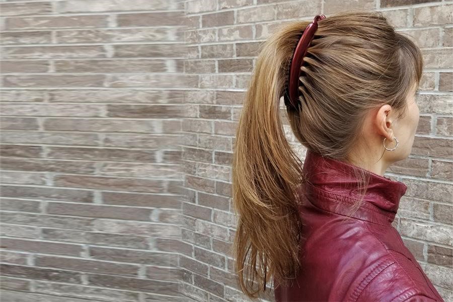 Woman using a red banana clip