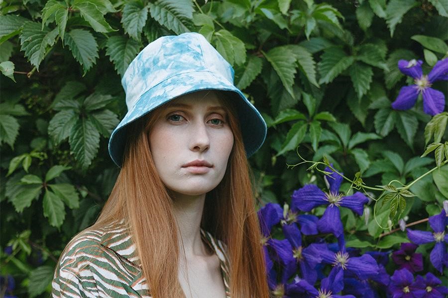 Woman wearing a tie-dye bucket hat