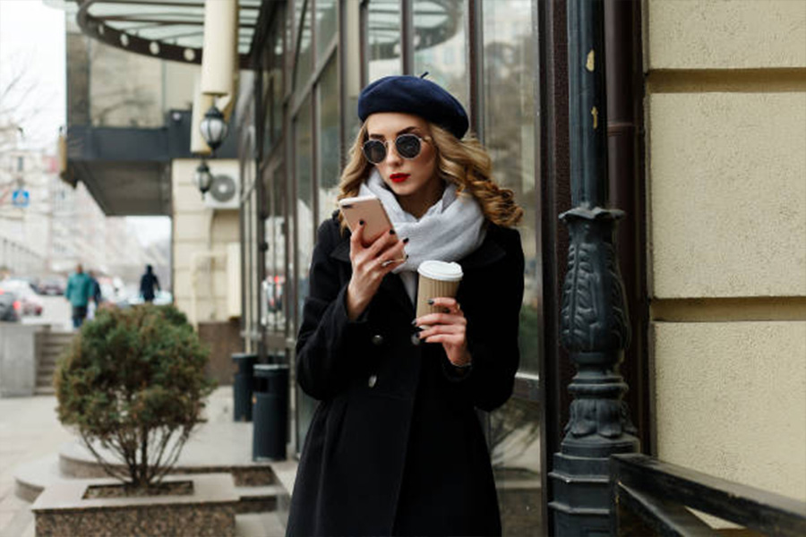 Woman wearing a warm coat and a navy blue beret