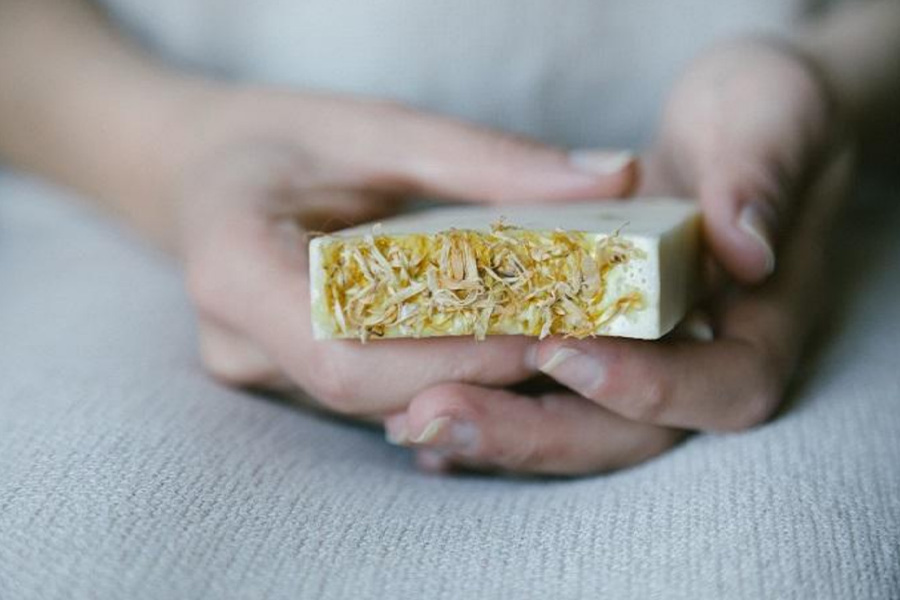 Woman with a solid soap in her hands