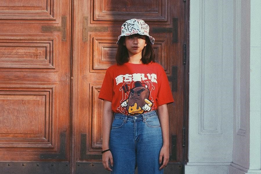 Young lady rocking a patterned bucket hat