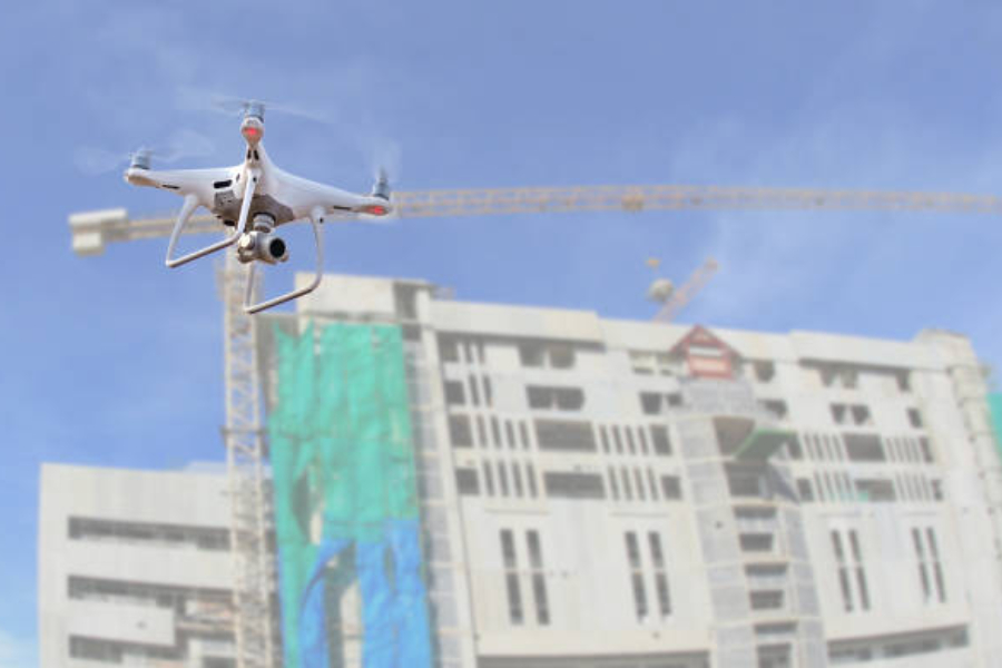 A drone copter flying over a construction site