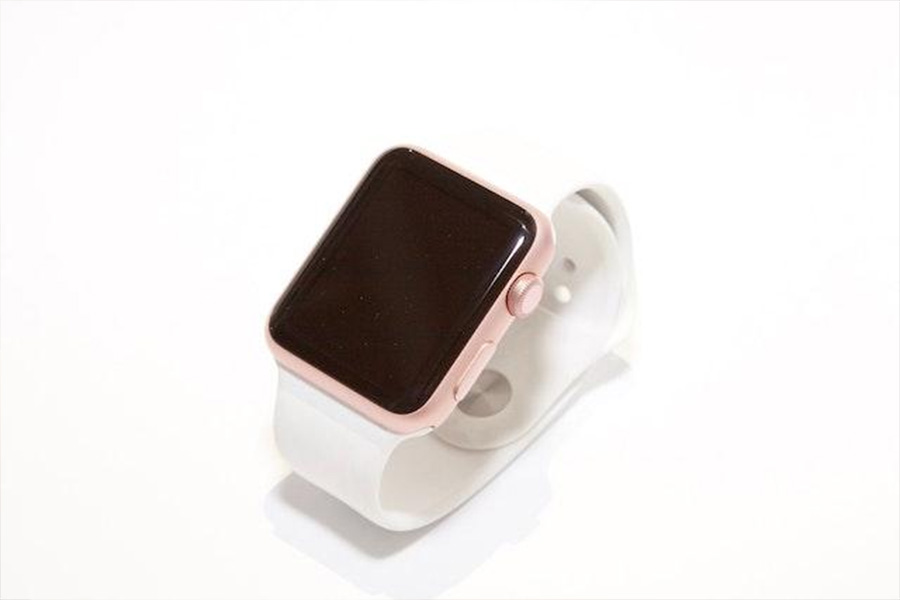 An Apple watch with pink casing