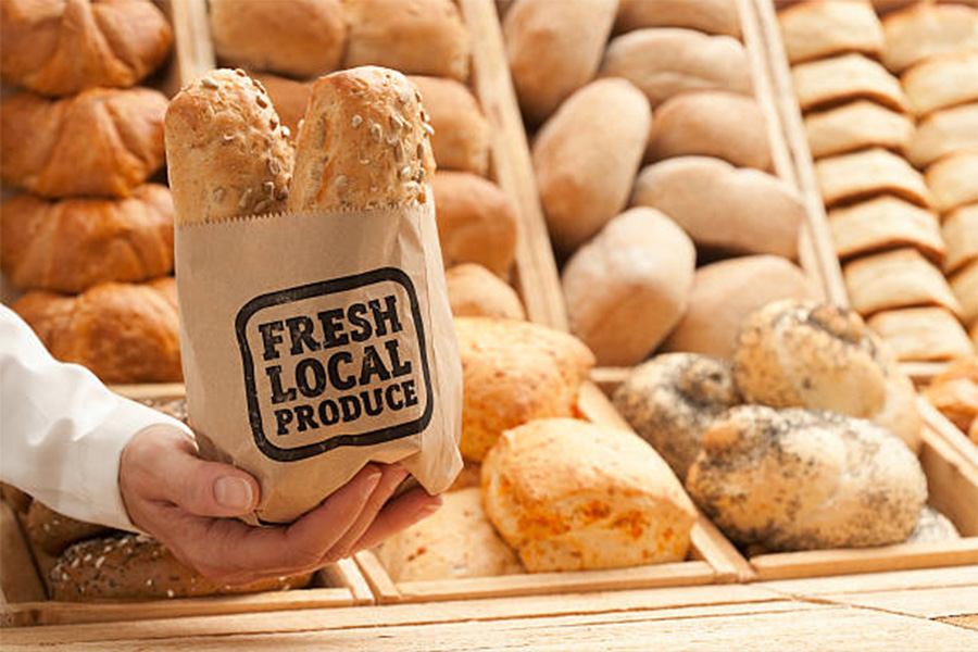 Brown paper bag used to hold fresh bread in bakery