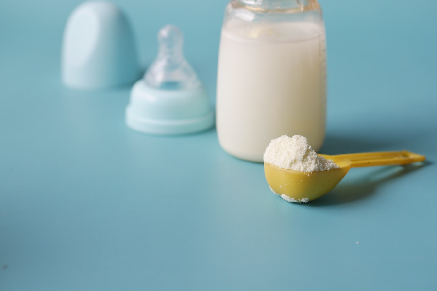 Close-up of scooped formula milk powder