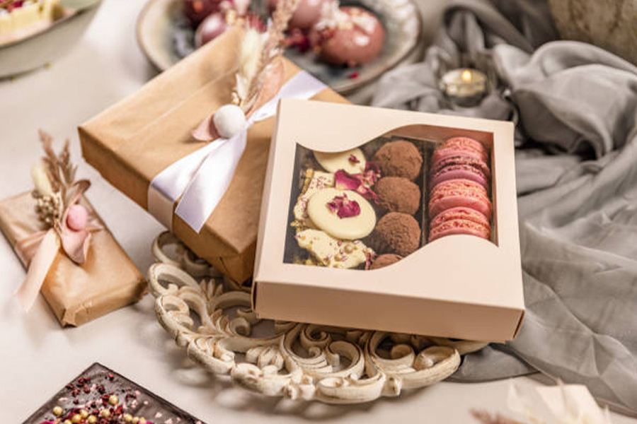 Fancy cake box with window showing baked goods inside