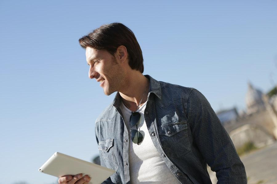 Man rocking a denim jacket and white inner shirt