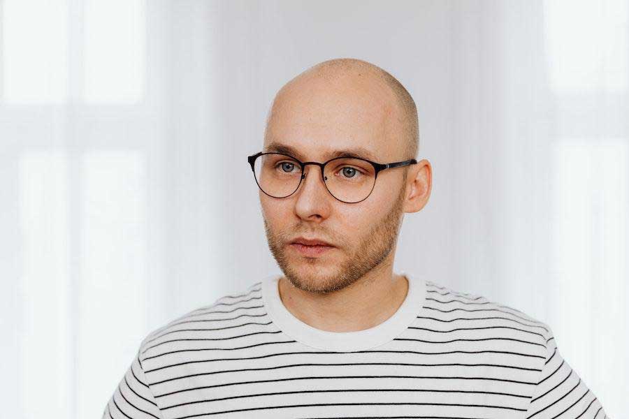 Man wearing glasses and nautical shirt