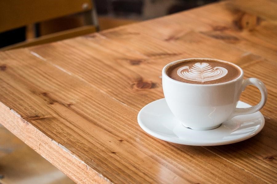 One medium-sized expresso on a white saucer