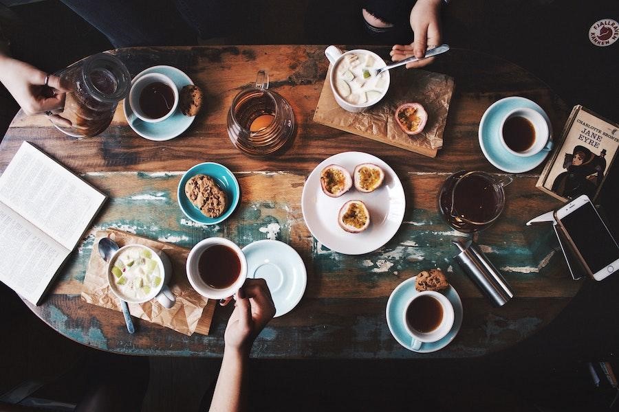 People taking coffee during breakfast