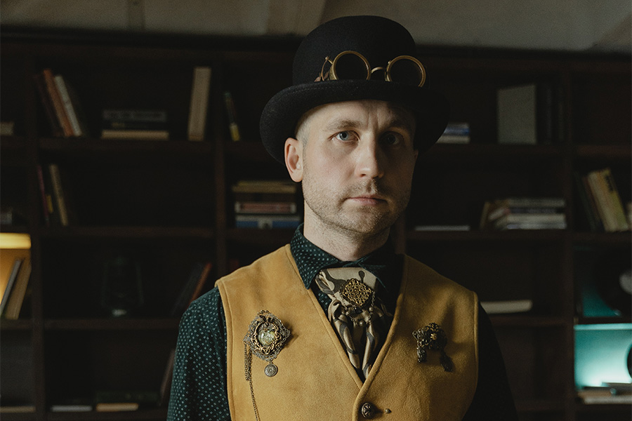 Serious looking man wearing a black bowler hat