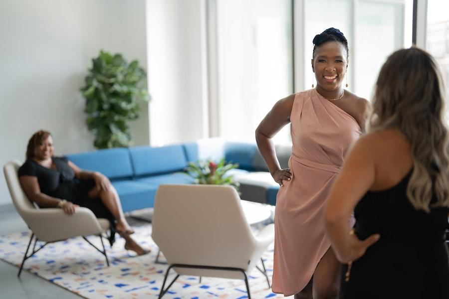 Smiling woman wearing a pink sensual dress