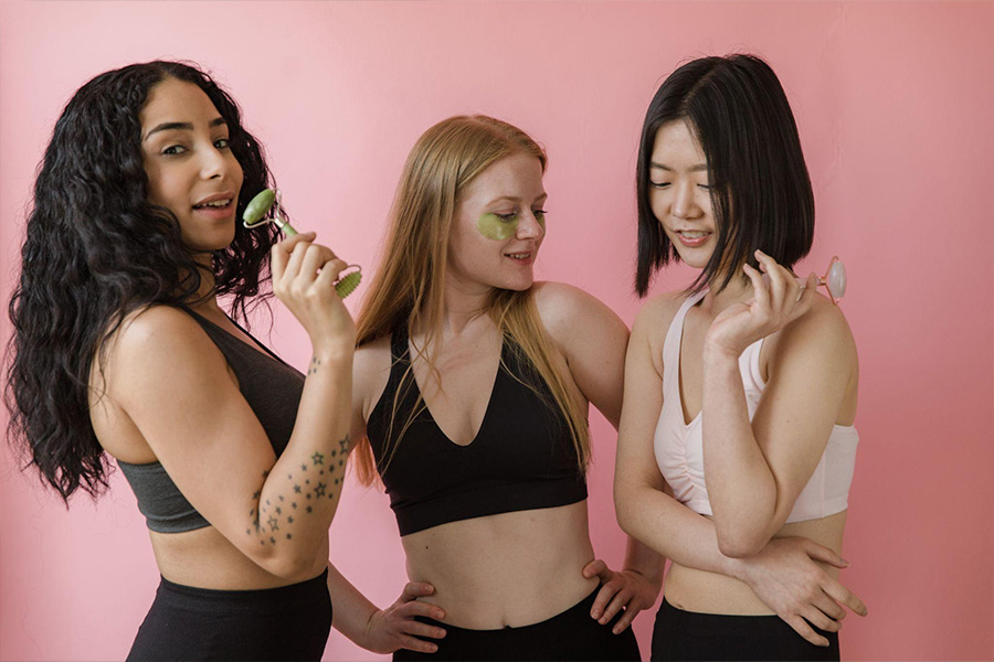 Three girls with beauty products