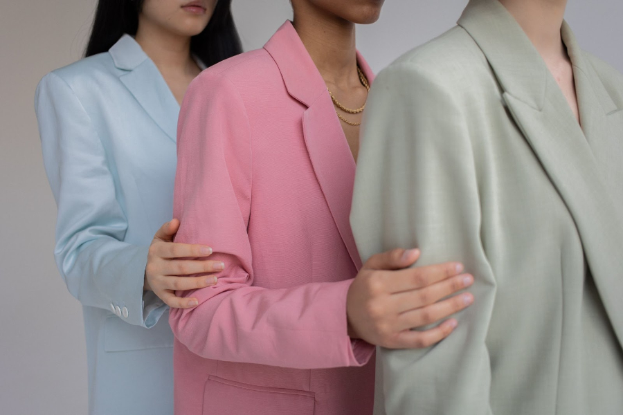 Three women in crisp, steamed clothes