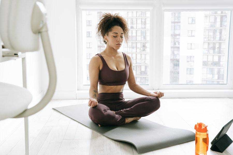 Woman in a sports bra top and matching high-waist pants