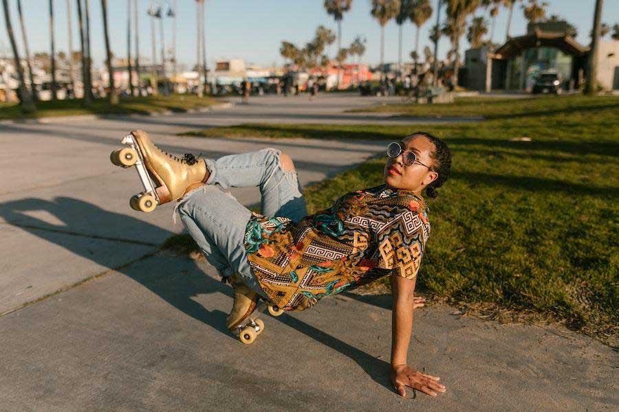 Woman on roller skates in a shirt and jeans