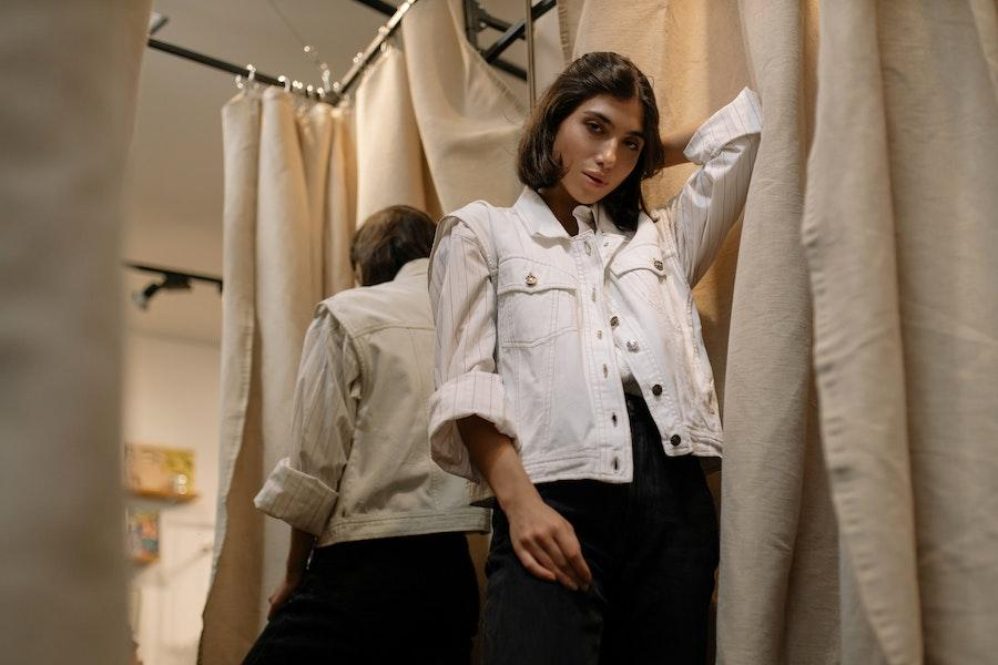 Woman posing in a white utility vest