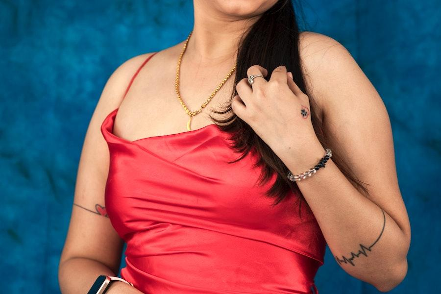 Woman posing with a red satin dress