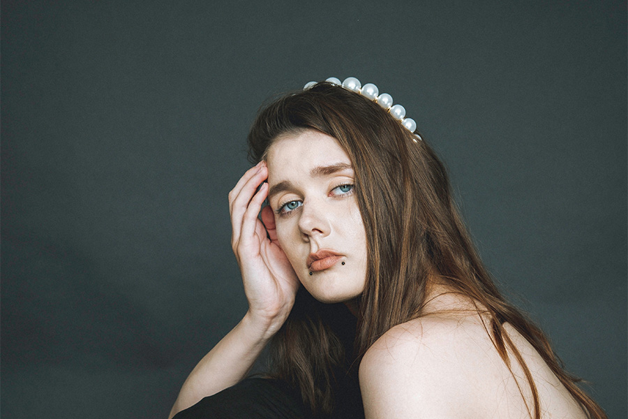 Woman rocking a jumbo pearl headband